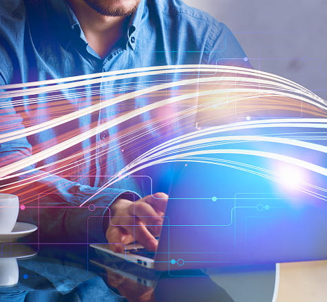 Business professional using cloud-connected devices with fiber internet services in Las Vegas